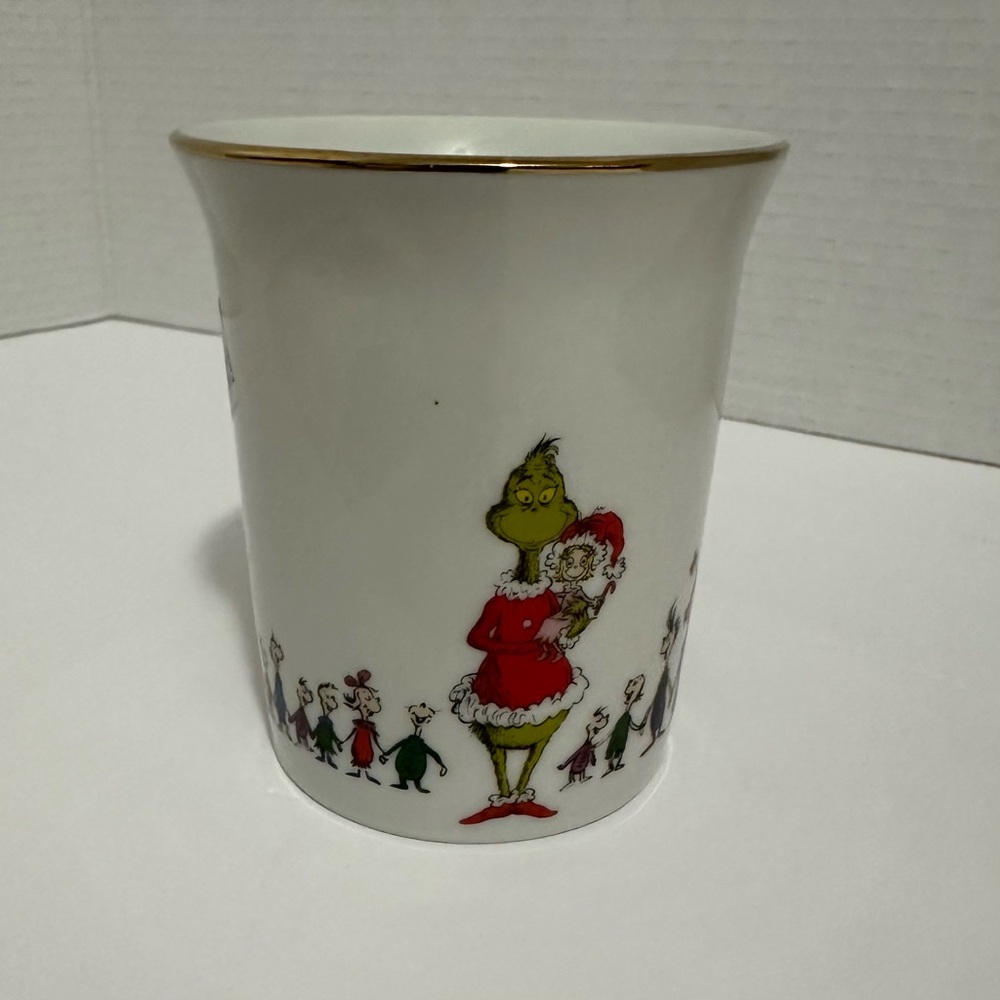 White Mug with Gold Handle and Cartoon Characters